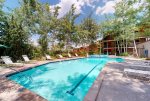 On-site amenities, include a shared outdoor heated pool, a hot tub